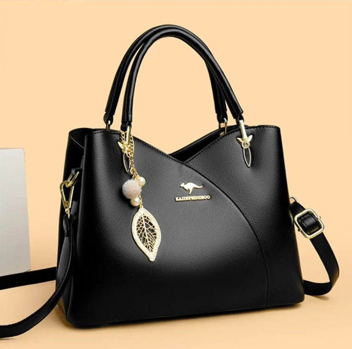 Felina™ - Elegancka czarna torebka na ramię z modnymi zawieszkami