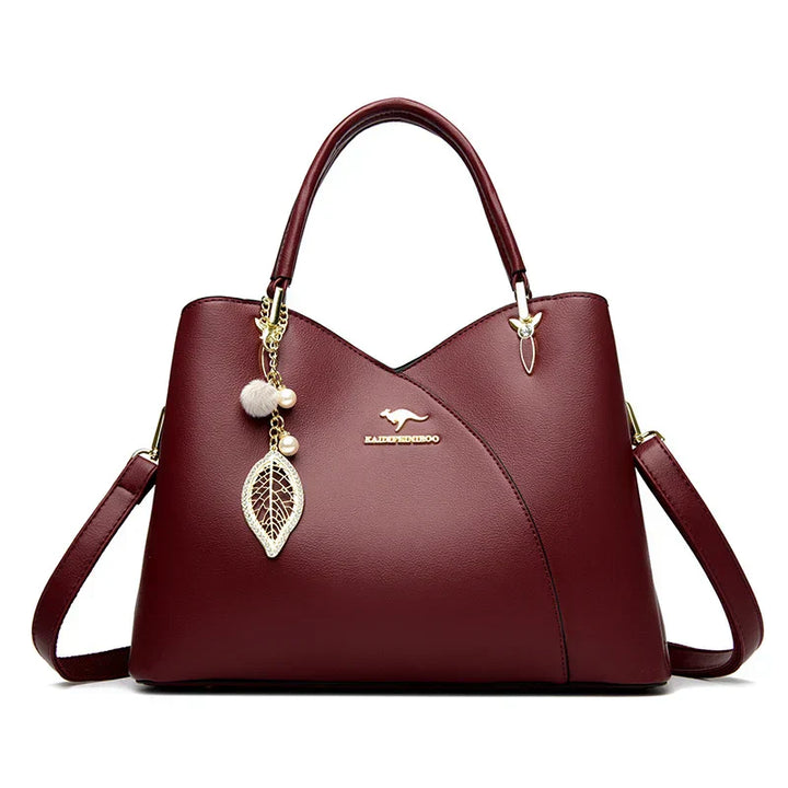 Felina™ - Elegancka czarna torebka na ramię z modnymi zawieszkami